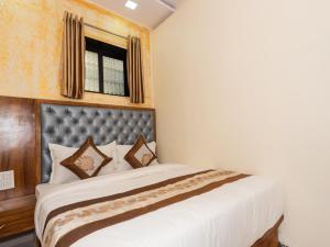 Postel nebo postele na pokoji v ubytování Hotel BKC Fortune
