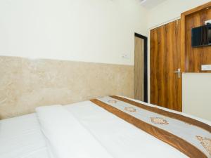 Postel nebo postele na pokoji v ubytování Hotel BKC Fortune
