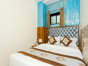 Postel nebo postele na pokoji v ubytování Hotel BKC Fortune