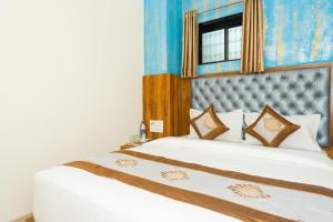 Postel nebo postele na pokoji v ubytování Hotel BKC Fortune