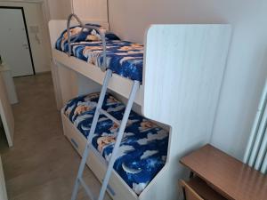 a couple of bunk beds in a room at Appartamento Torre Pedrera Rimini in Rimini