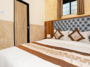 Postel nebo postele na pokoji v ubytování Hotel BKC Fortune
