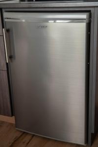 a stainless steel refrigerator in a kitchen at Boutique Hotel Anna by EJ Hotels in Holt