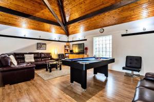 a living room with a pool table in it at Finest Retreats - Woodstock Lodge in Bishop Middleham