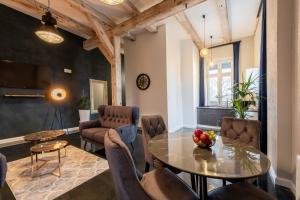 a living room with a table and chairs at KaJo Apartamenty in Świdwin