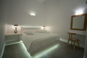 Cama ou camas em um quarto em Fanari Vista Suites