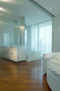Letto o letti in una camera di i-Suite Hotel