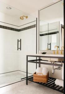 a bathroom with a sink and a shower at Hotel Emeline in Charleston