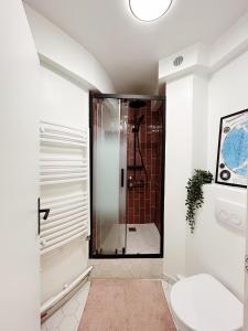 a bathroom with a shower and a toilet at STUDIO Retro MARAIS- Paris Center in Paris