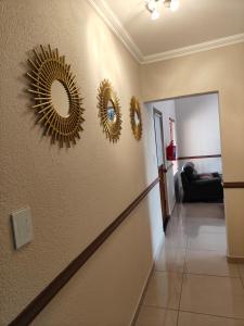 a hallway with three mirrors on the wall at Unit 89 Pendleberry Holiday Resort in Bela-Bela