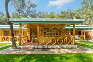 Oxygen Palolem في بالوليم: منزل خشبي بسقف أخضر