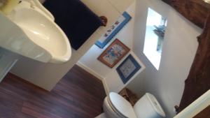a bathroom with a sink and a toilet at Le moulin des cavaliers in La Rouquette +17 photos