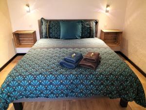 Postel nebo postele na pokoji v ubytování Le Jardin Des Hirondelles