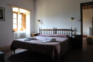 Agriturismo "Ai frati" tesisinde bir odada yatak veya yataklar