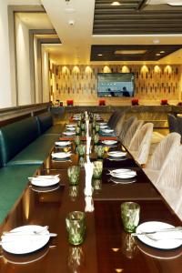 a long dining room with a long table at BluSalzz Residence Amritsar in Amritsar