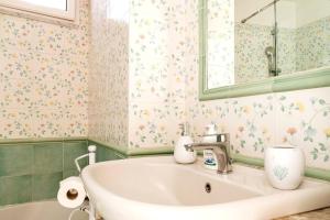 a bathroom with a sink and a mirror at Casa del pozzo sulla spiaggia in Cetara +20 photos