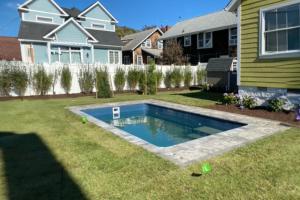 a house with a swimming pool in the yard at Town of Rehoboth Beach 45 Baltimore Ave in Rehoboth Beach