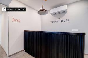 a room with a black radiator and a sign on the wall at Townhouse Akota Mujmahuda Road - Managed by Company in Vadodara