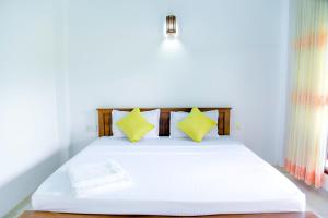 Giường trong phòng chung tại Paddy Field View Resort
