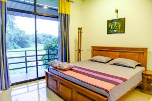 Giường trong phòng chung tại Paddy Field View Resort