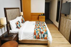 Voodi või voodid majutusasutuse BluSalzz Residence Amritsar toas