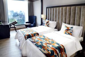 Voodi või voodid majutusasutuse BluSalzz Residence Amritsar toas