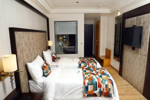 Voodi või voodid majutusasutuse BluSalzz Residence Amritsar toas