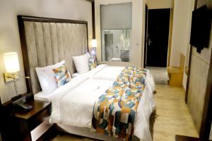 Voodi või voodid majutusasutuse BluSalzz Residence Amritsar toas