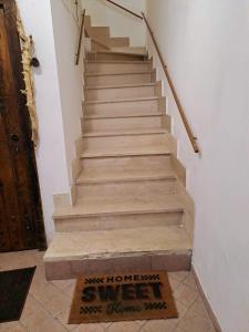 a set of stairs with a sign on the floor at B&B Monolocale Piazza Dante in Teramo