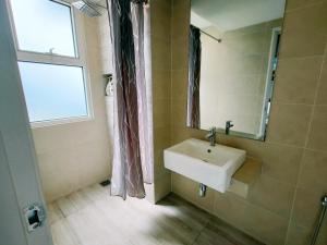 a bathroom with a sink and a window at Windmill Pemium 2-bedrooms at Genting High Floor Free WiFi in Genting Highlands