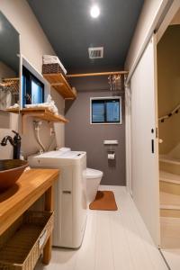 a bathroom with a toilet and a sink at Kyoto 幸 in Kyoto