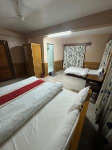 Postelja oz. postelje v sobi nastanitve Boudha Dungkar guest house