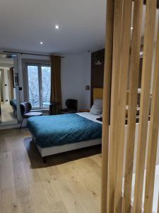 Ένα ή περισσότερα κρεβάτια σε δωμάτιο στο Suite st lô 1 Rouen (centre historique)