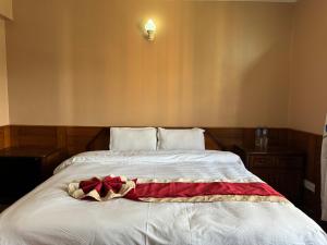Postelja oz. postelje v sobi nastanitve Boudha Dungkar guest house