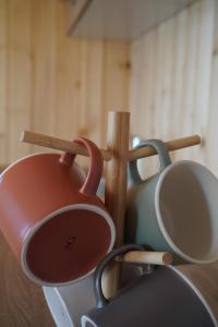 a group of cups and utensils on a table at Villa standard n'Bjeshkë in Dragash