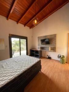 Säng eller sängar i ett rum på Casa en Villa Carlos Paz Villa del lago
