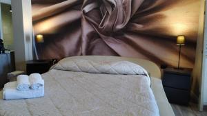 Postel nebo postele na pokoji v ubytování CconfortHotels R&B Cavour
