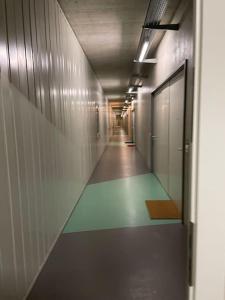 an empty hallway with a corridorngthngthngthngthngthngthngthngthngthngth at Le Mont-sur-lausanne: superbe studio ! in Le Mont-sur-Lausanne
