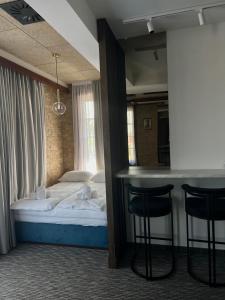 Ένα ή περισσότερα κρεβάτια σε δωμάτιο στο Hotel Zlatni Bor