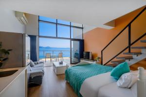 a bedroom with a bed and a large window at Xiaojing Bay Haige Hotel in Huidong