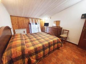 Llit o llits en una habitació de La casa in montagna