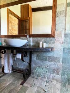 a bathroom with a sink and a mirror at Chacra La Esencia, casa de campo in El Eden +34 photos