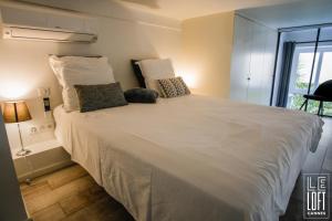 Posteľ alebo postele v izbe v ubytovaní Le loft Cannes