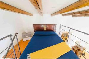 a bedroom with a bed in a room at Archimede Suite Apartment - Morici Street in Palermo