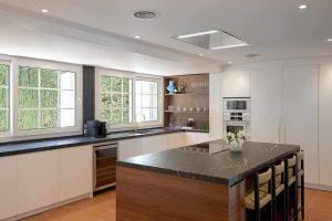 a large kitchen with a island in the middle at Villa en Calonge con Gran piscina in Calonge