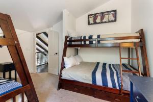 a bedroom with two bunk beds and a staircase at West Vail Matterhorn Circle 5 in Vail