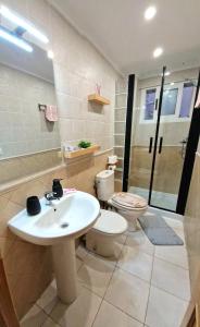 a bathroom with a sink and a toilet and a shower at Apartment Svetlana in Alicante