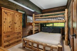 a bedroom with two bunk beds in a cabin at West Vail Interlochen Condo B8 in Vail