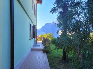 a hallway leading to a house with a view of a mountain at Appartamento Marocche in Nago-Torbole