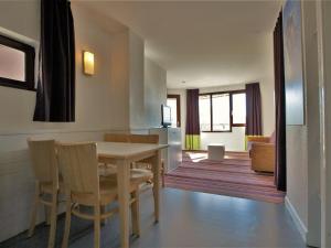 a kitchen and dining room with a table and chairs at Appartement Avoriaz, 2 pièces, 5 personnes - FR-1-314-213 in Morzine